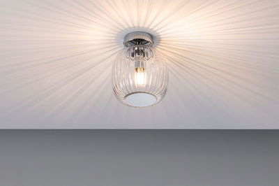 Ceiling light with ribbed clear glass and warm white light for elegant room illumination