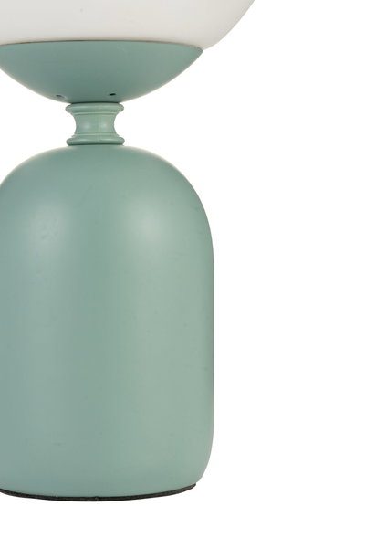Close-up of a matte mint green metal lamp base for modern lighting design