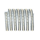 Flexible LED strip with warm white LEDs on transparent base for versatile lighting solutions.