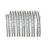 Flexible LED strip with warm white LEDs on transparent base for versatile lighting solutions.