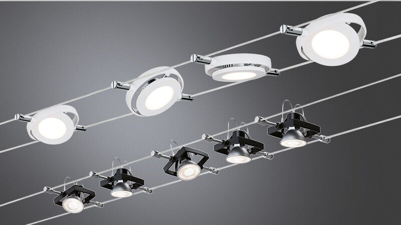 Système de câbles moderne avec spots LED blancs et noirs en métal pour un éclairage polyvalent