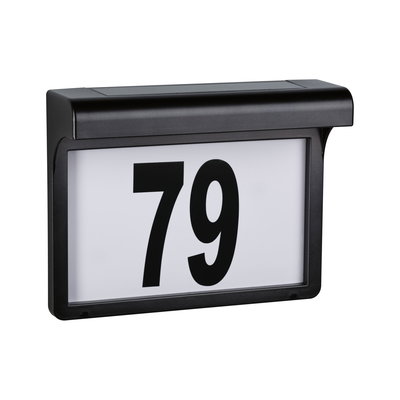 Black plastic house number sign with large white panel and black digits 79 for outdoor lighting
