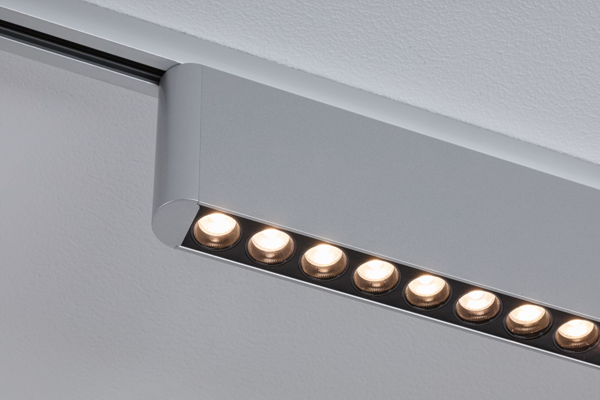 Modern silver aluminium LED ceiling spotlight with multiple warm white light sources