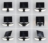 Schwarze Solar-Außenleuchte mit verstellbarem Solarpanel und zwei weißen LED-Leuchtflächen für Gartenbeleuchtung