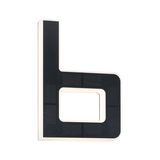 Modern L-shaped LED wall light with black surface and white illumination for indoor use