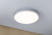 Round white LED ceiling light with matte frame on grey ceiling for modern room lighting