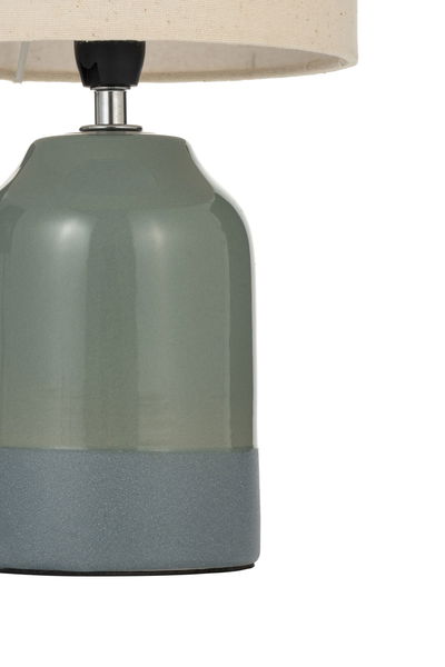 Table lamp with green ceramic base and grey bottom, cream fabric shade, decorative home lighting