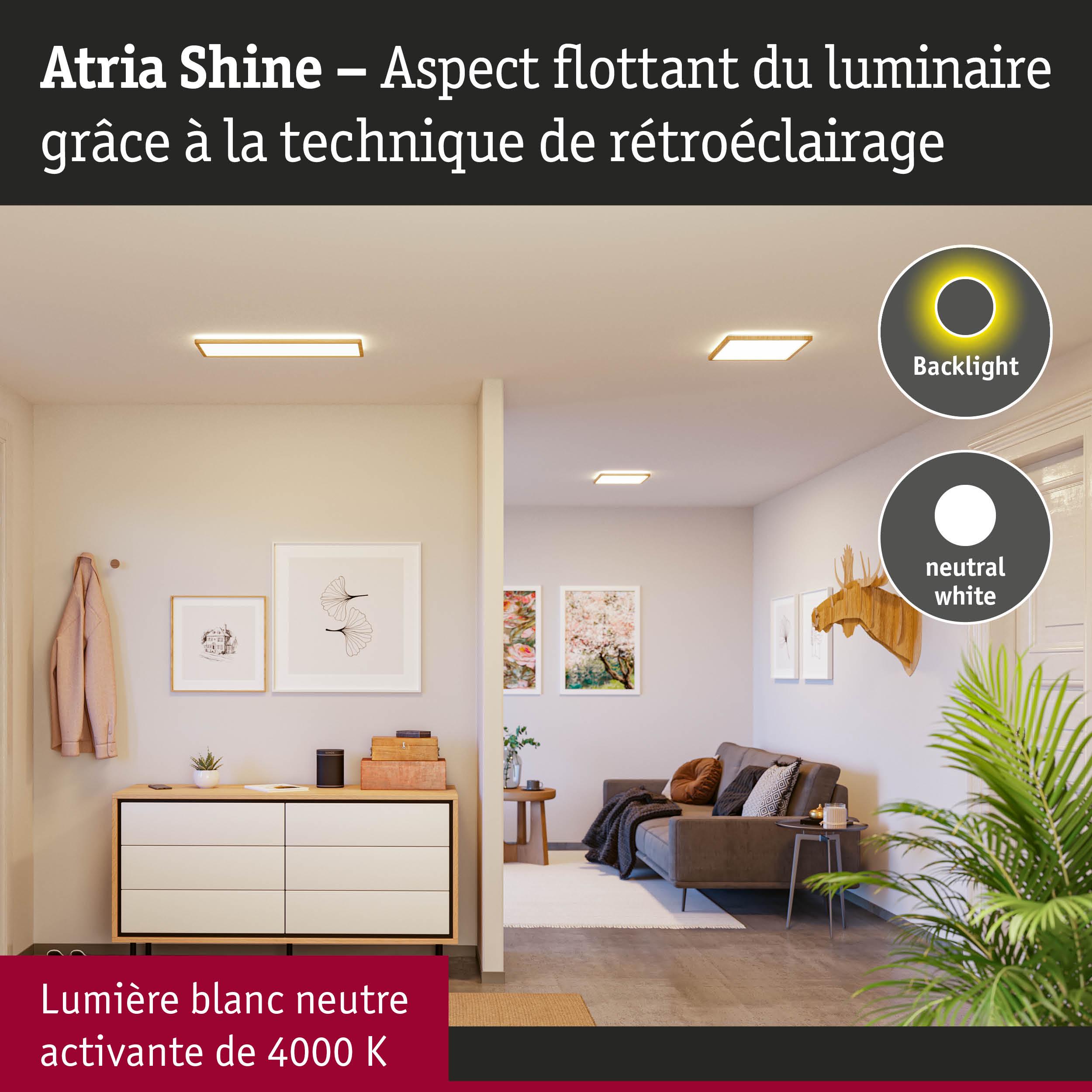 Salon avec luminaires LED Atria Shine en lumière blanc neutre et effet rétroéclairage
