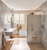 Modern bathroom with grey tiles, wood-effect floor and chrome shower fitting for bathroom design ideas