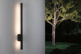 Black metal LED wall light with warm white glow for modern outdoor garden lighting solutions.