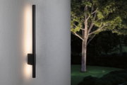 Black metal LED wall light with warm white glow for modern outdoor garden lighting solutions.