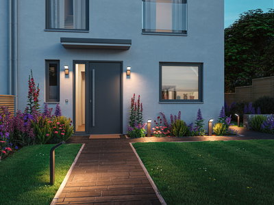 Moderne husindgang med antracitgrå dør og LED-udendørsbelysning langs sti og facade ved skumring