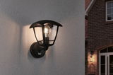 Schwarze Außenwandleuchte aus Metall mit klarem Glas und sichtbarer Glühbirne für Hausfassadebeleuchtung