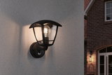 Sort metal udendørs væglampe med klart glas og synlig pære til facadebelysning