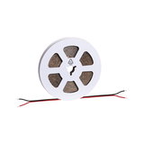 Roll of white LED strip light with red and black wires for versatile lighting solutions