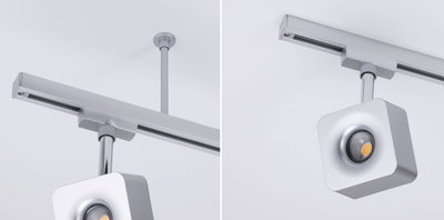 Moderner quadratischer LED-Strahler in Silber aus Metall an Schienensystem für flexible Beleuchtung