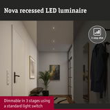 Nova white recessed LED luminaire with 3-step dimming in a modern hallway with coat rack and artwork