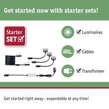 Starter set with black cables, transformer, and luminaires for expandable lighting systems