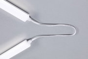 Two white LED light bars connected by white cable on grey background, LED lighting accessory