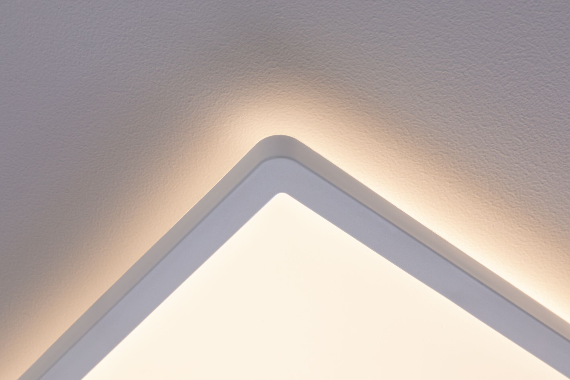 Square white LED ceiling light with warm indirect lighting for modern interior design