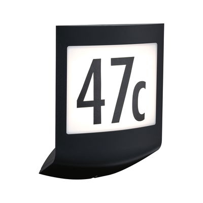 Black LED house number sign with white background and black digits 47c for outdoor lighting