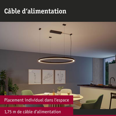 Suspension LED ronde noire avec câble d’alimentation de 1,75 m dans une salle à manger moderne.