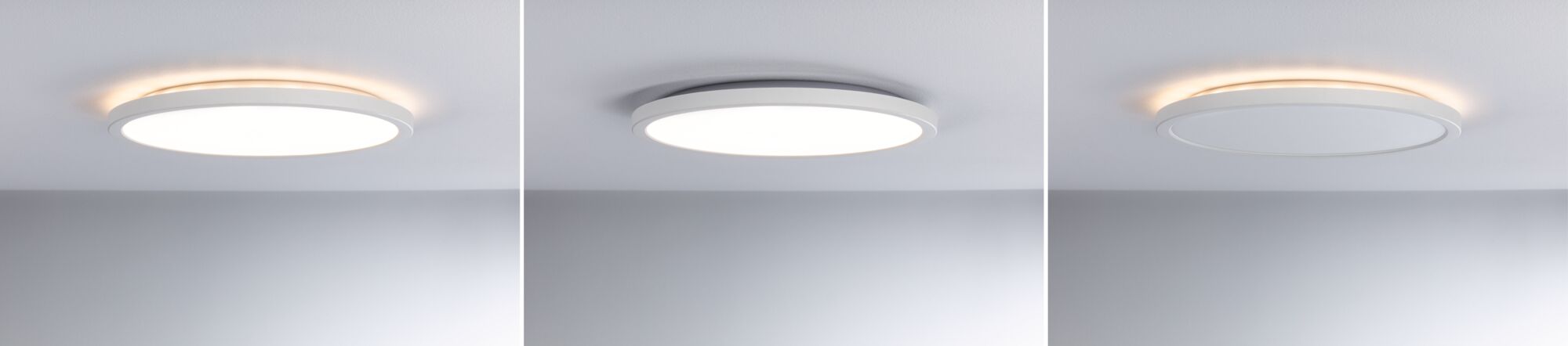 Tre hvide runde LED-loftslamper med varmt hvidt lys og moderne design på gråt loft