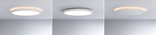 Three white round LED ceiling lights with warm white light and modern design on gray ceiling