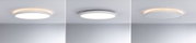 Trois plafonniers LED ronds blancs avec lumière blanc chaud et design moderne sur plafond gris
