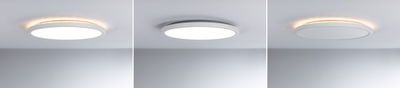 Tre hvide runde LED-loftslamper med varmt hvidt lys og moderne design på gråt loft