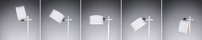Lampadaire LED blanc moderne avec abat-jour réglable et accents métalliques pour intérieur.