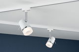 Two white metal LED spotlights with chrome ring on white track for modern room lighting