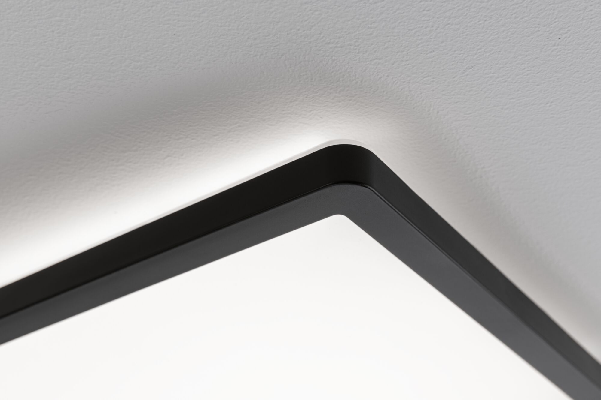Black aluminum ceiling light with white diffuser and indirect LED lighting for modern interior design