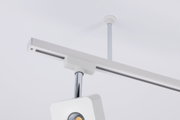 Modern white LED track spotlight with chrome rod for flexible indoor lighting solutions