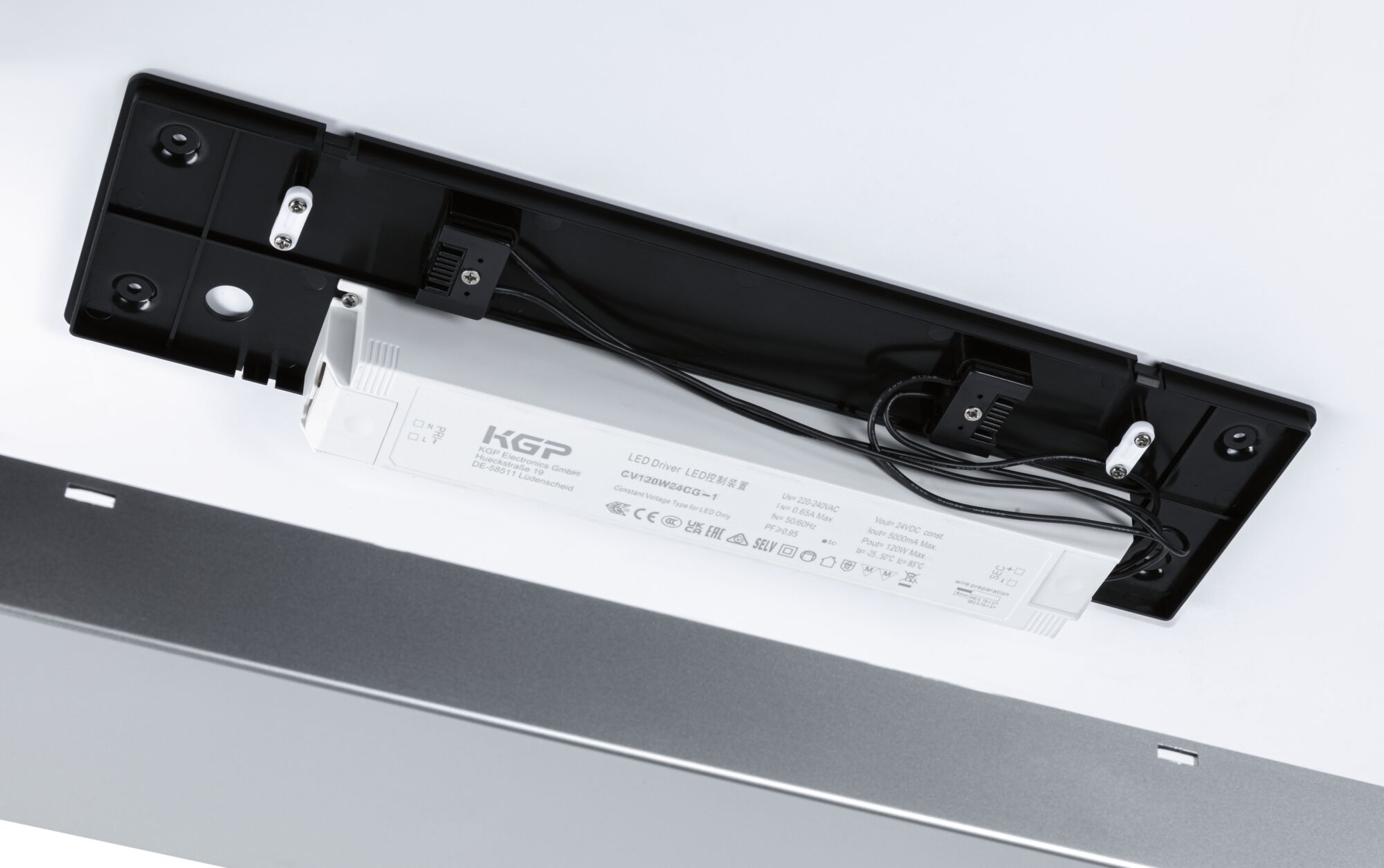 White KGP LED driver with black mount, technical component for LED lighting systems