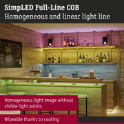 Bar with wooden shelves and coloured LED lighting creating homogeneous light lines without visible points