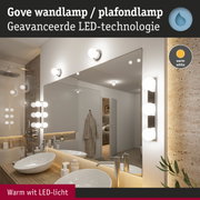 Gove LED wand- en plafondlamp met warm wit licht in moderne badkamer met spiegel en houten blad.