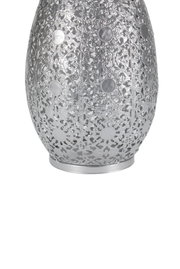 Silver metal vase with intricate floral pattern and shiny finish for elegant home decoration