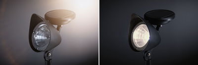 Black solar garden light with LED spotlight and round solar panel for energy-saving outdoor lighting