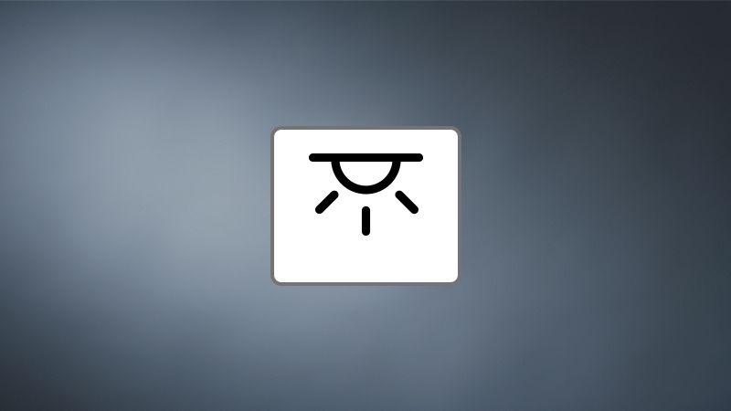 Ceiling mounting icon showing stylized lamp with light rays on grey background