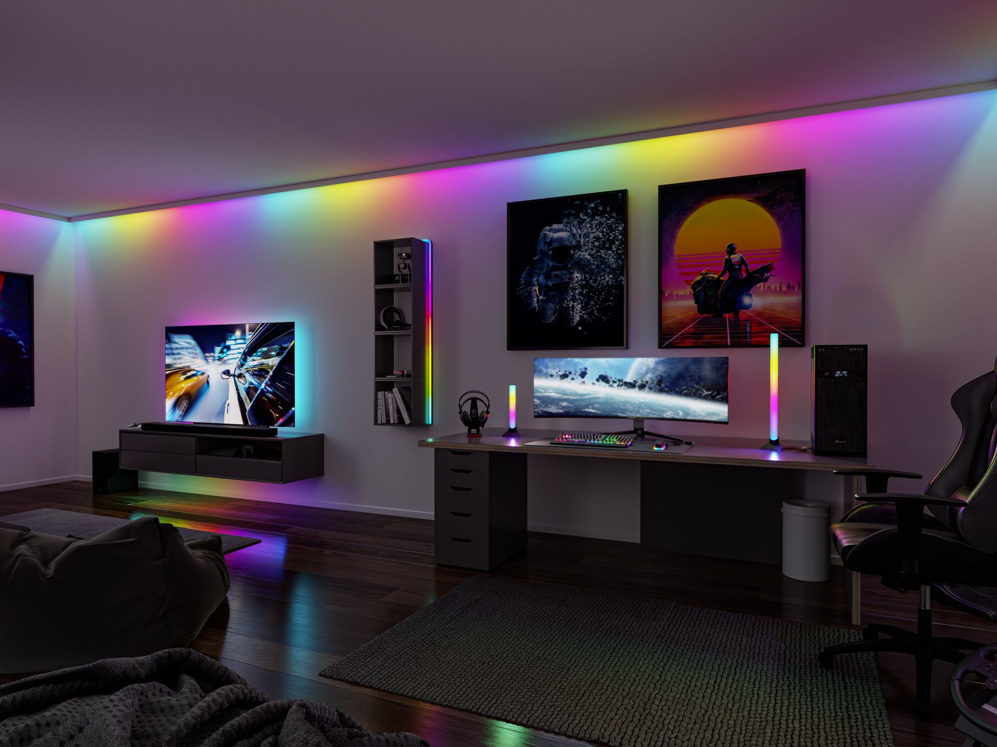 Modern gaming room with RGB LED lighting on wall, desk, and TV creating ambient colorful light effects.