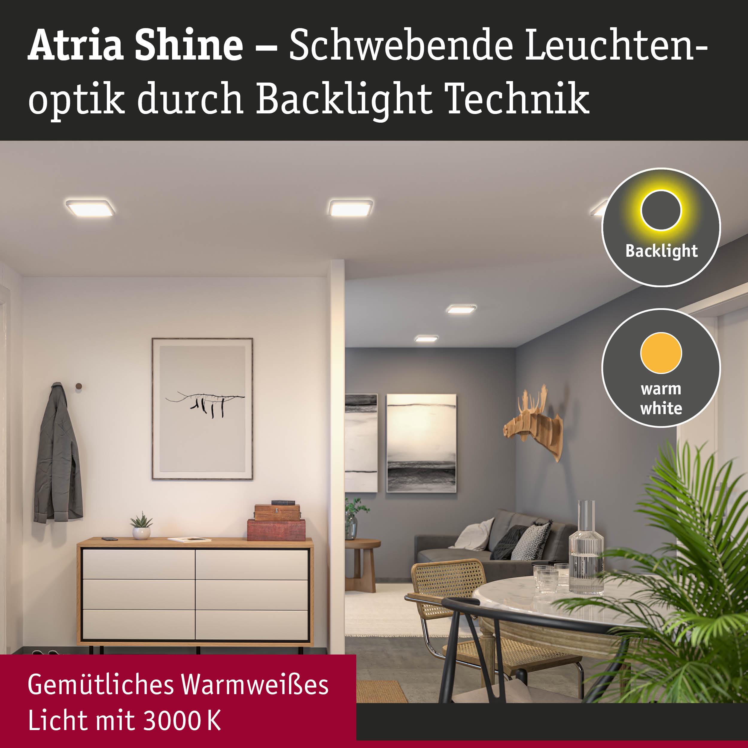 Wohnzimmer mit Atria Shine LED-Deckenleuchten in warmweißem Licht und moderner Einrichtung