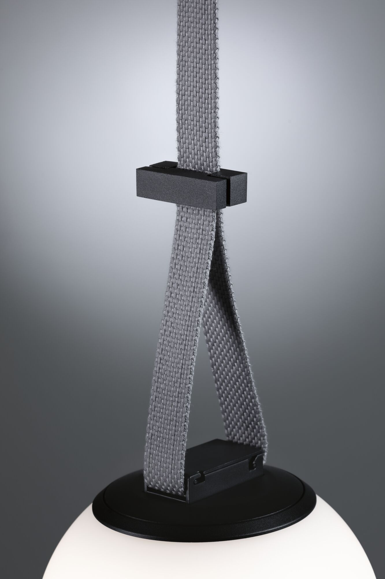 Modern pendant light with black metal holder and grey textile strap, white glass globe