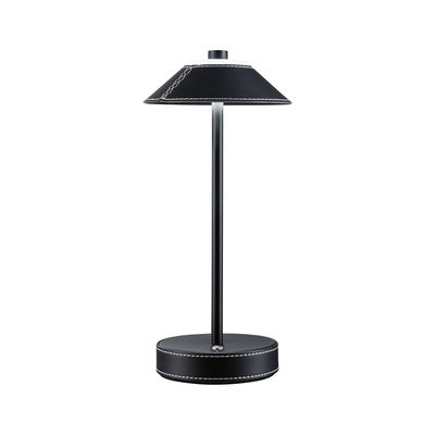 Black table lamp with leather cover and white stitching, modern LED light for living spaces