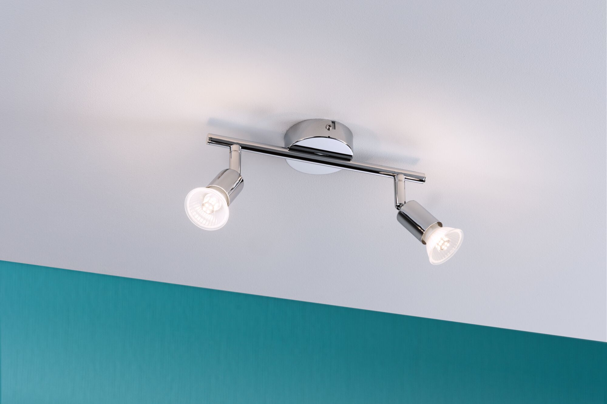Modern ceiling spotlight in chrome metal with two LED lights for targeted room illumination