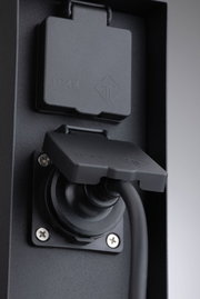 Black IP44 socket with protective cover made of plastic for safe outdoor use