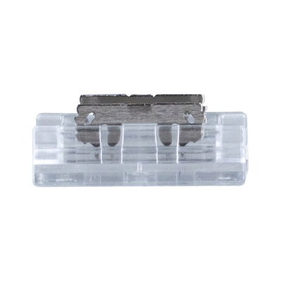 Small transparent plastic component with metal clip for electrical connections