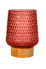 Red textured glass lamp on light wooden base, decorative lighting for living spaces