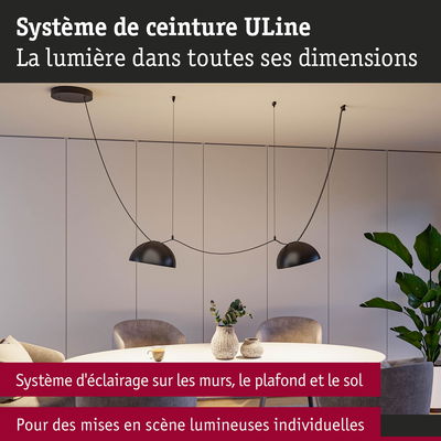 Système d'éclairage ULine moderne avec suspensions noires au-dessus d'une table ronde dans une salle à manger