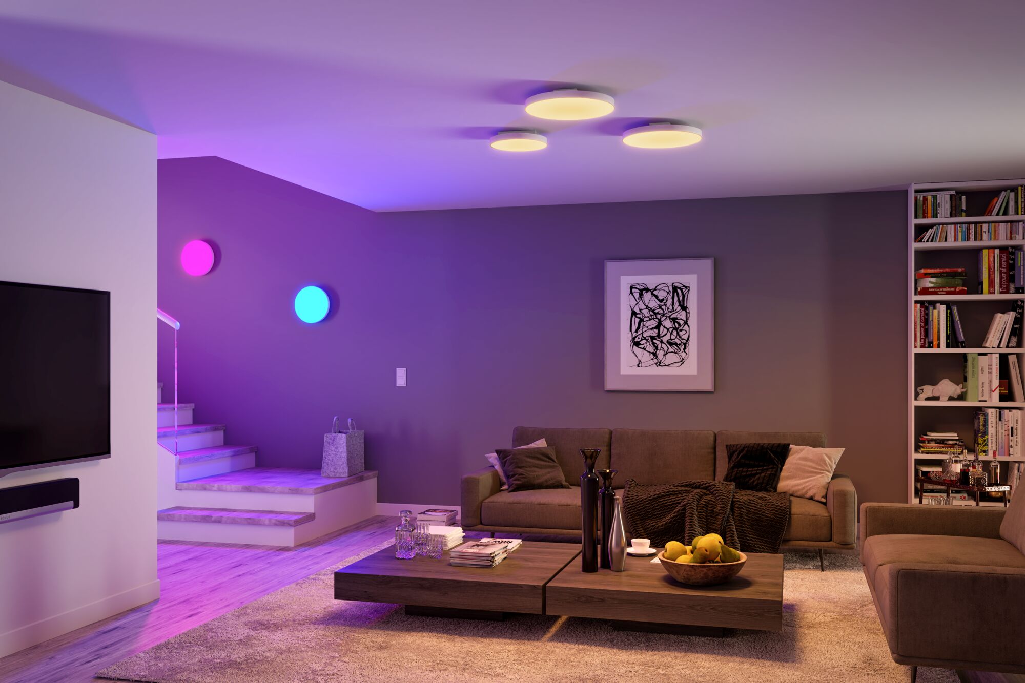 Modern living room with white round ceiling lights and coloured wall lamps in blue and pink